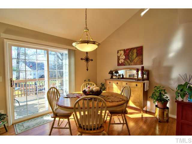 6 Bethany Place Durham, NC 27712 - Photo 3 of 12 a view of a dining room with furniture and chandelier