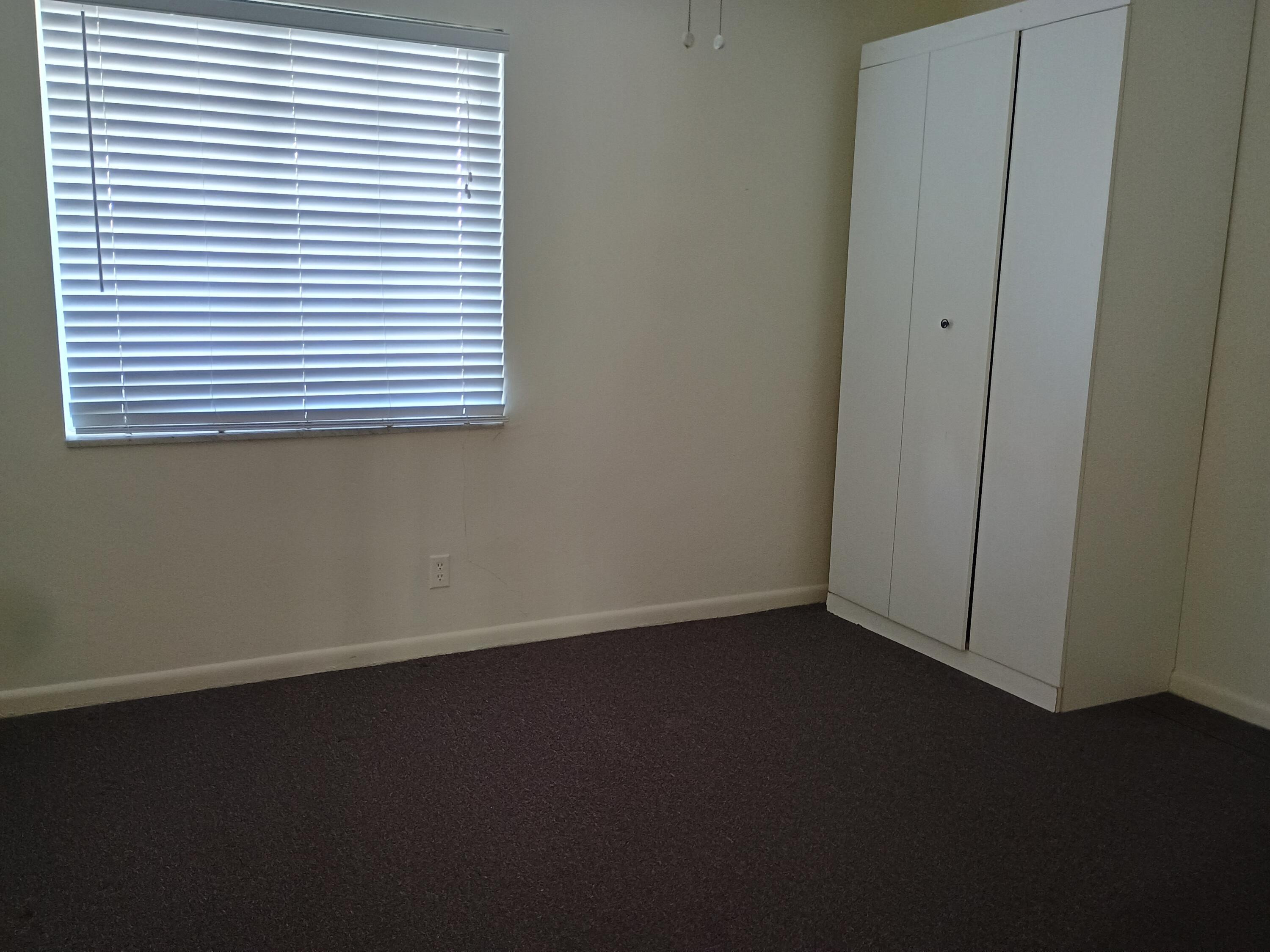 5505 North Ocean Boulevard, Unit 8110 Ocean Ridge, FL 33435 - Photo 17 of 18 an empty room with a window