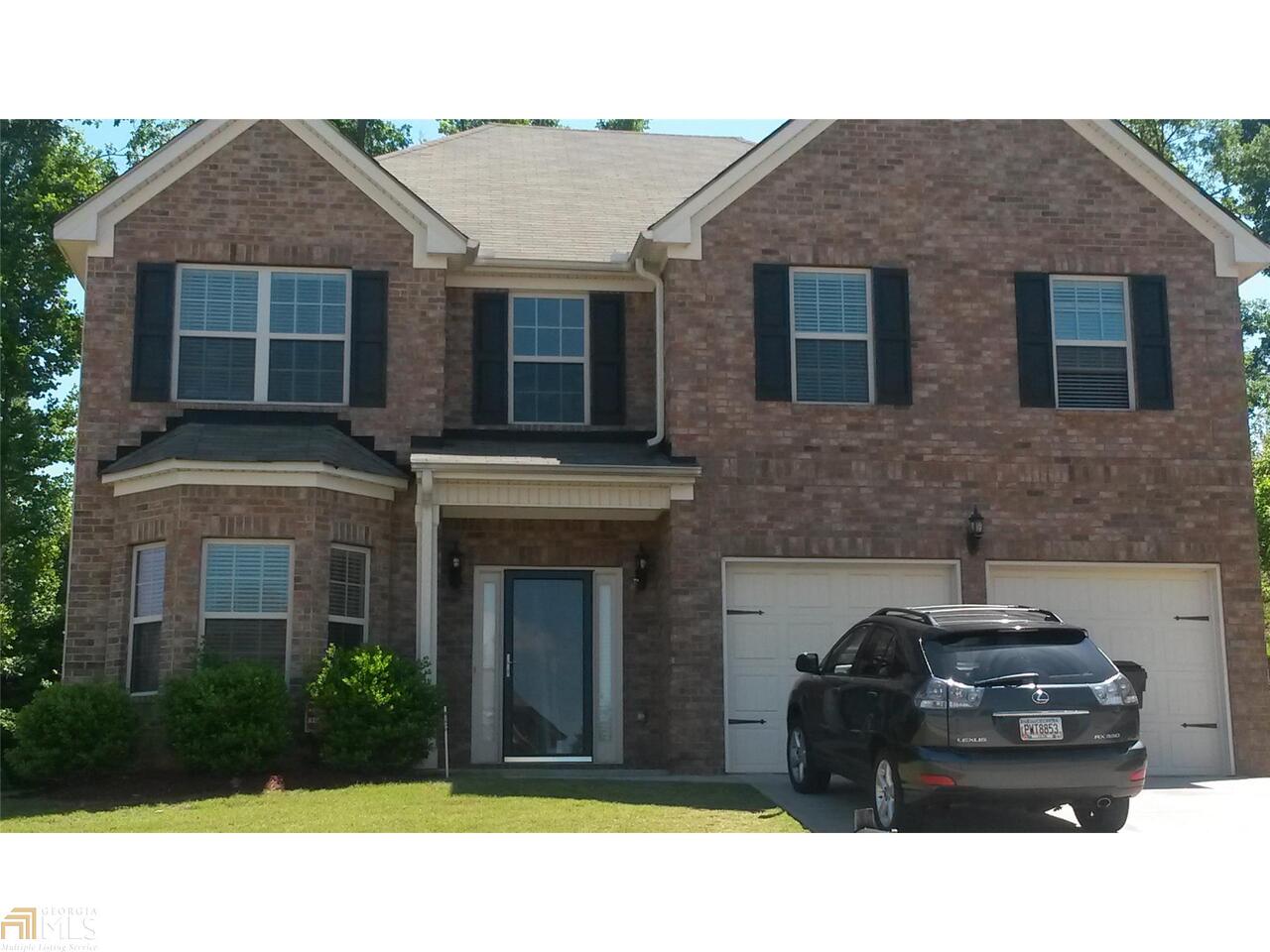 6939 Misttop Loop Fairburn, GA 30213 - Photo 1 of 1 a black and white building with a outdoor space