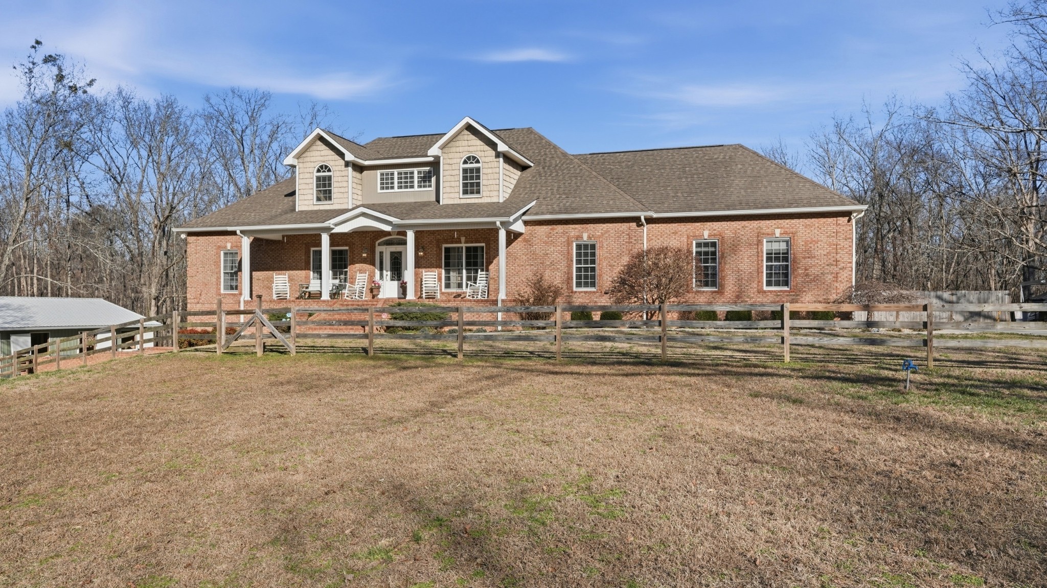 135 Vols Lane Estill Springs, TN 37330 - Photo 1 of 56 a front view of a house with a yard