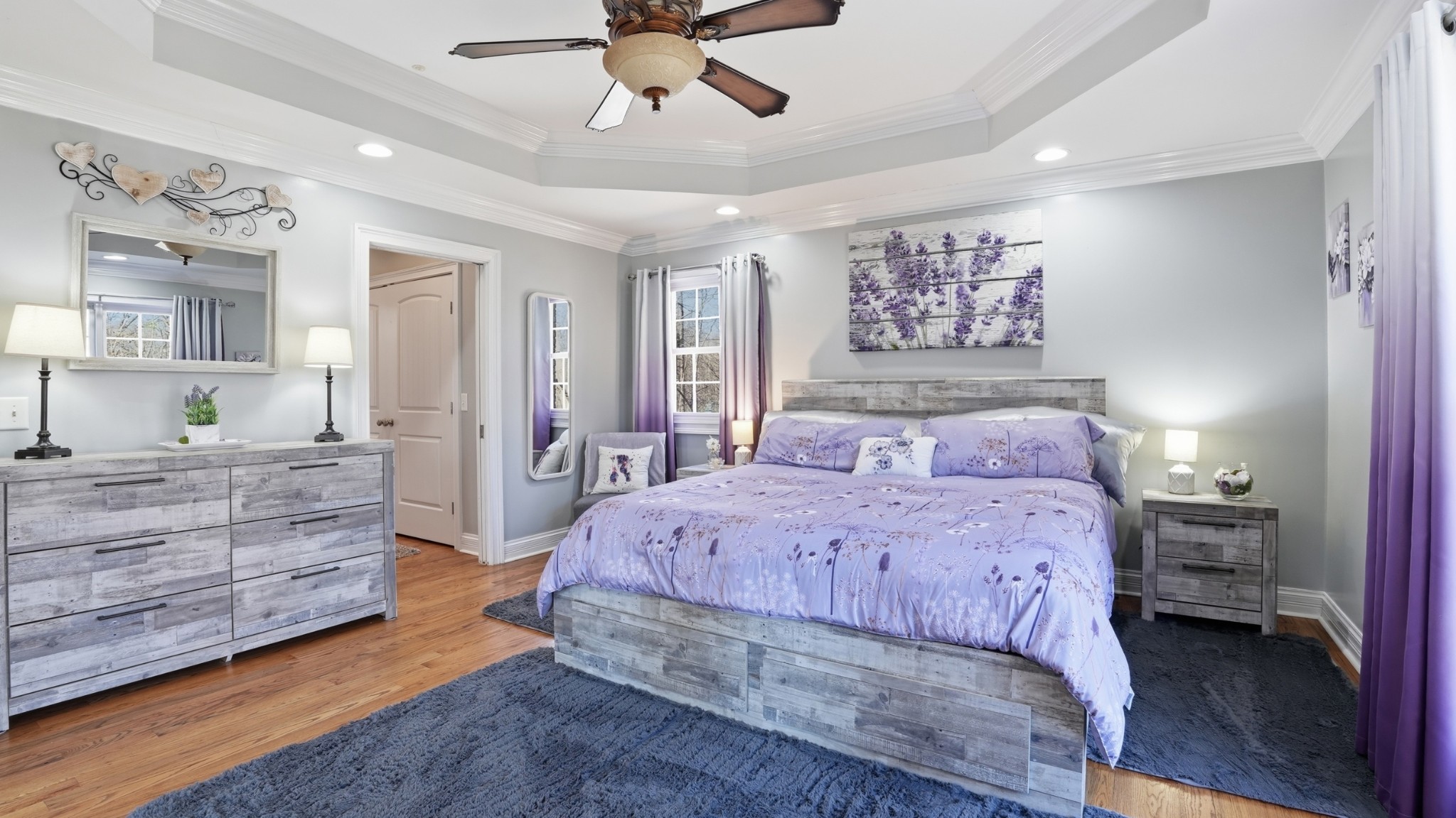 135 Vols Lane Estill Springs, TN 37330 - Photo 16 of 56 a spacious bedroom with a bed and ceiling fan
