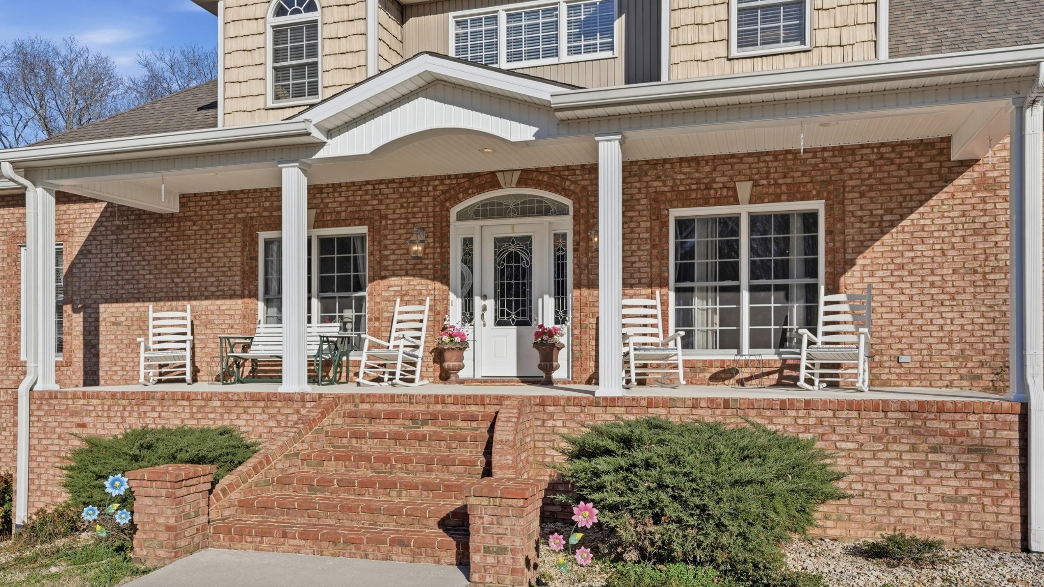 135 Vols Lane Estill Springs, TN 37330 - Photo 4 of 56 front view of a brick house with a large window