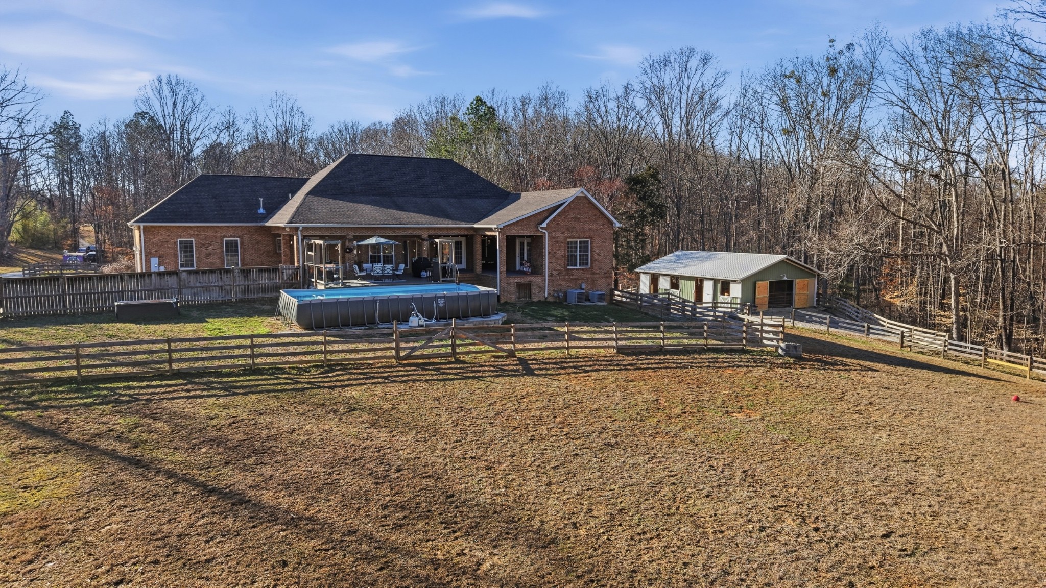 135 Vols Lane Estill Springs, TN 37330 - Photo 47 of 56 a front view of a house with a yard fountain and large trees