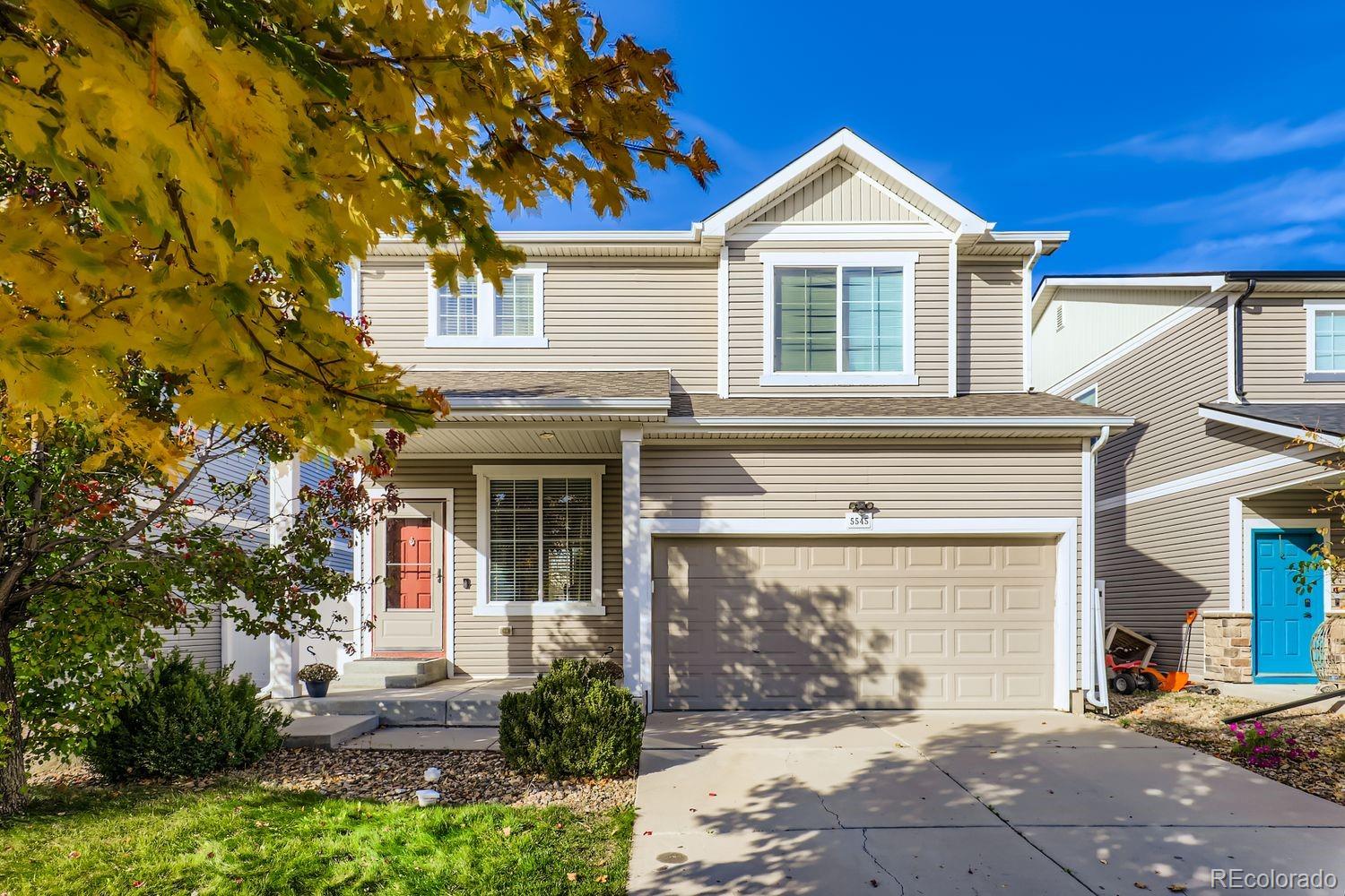 5545 Liverpool Street Denver, CO 80249 - Photo 2 of 28 a front view of a house with a yard
