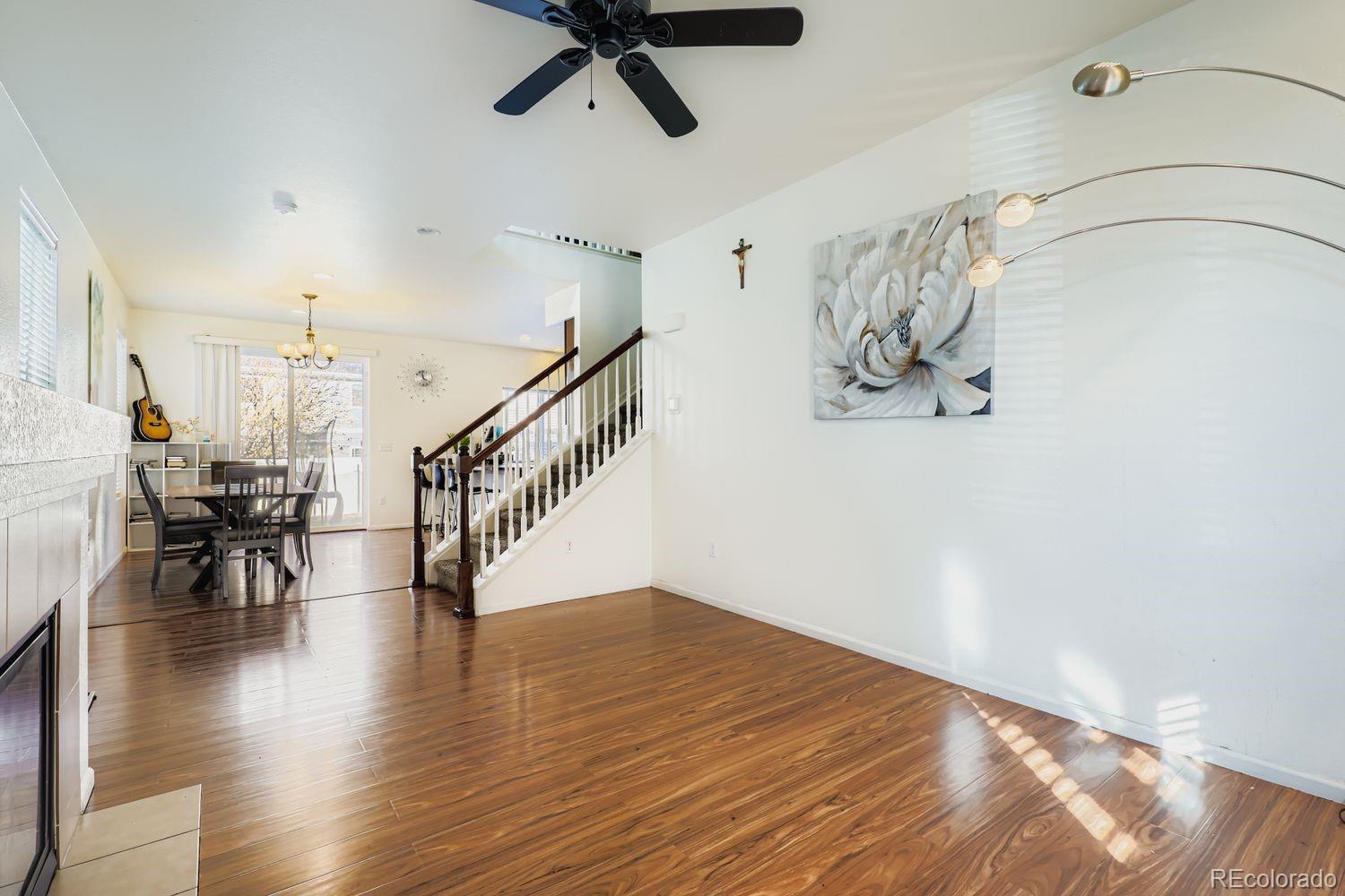 5545 Liverpool Street Denver, CO 80249 - Photo 6 of 28 a view of entryway and hall with wooden floor