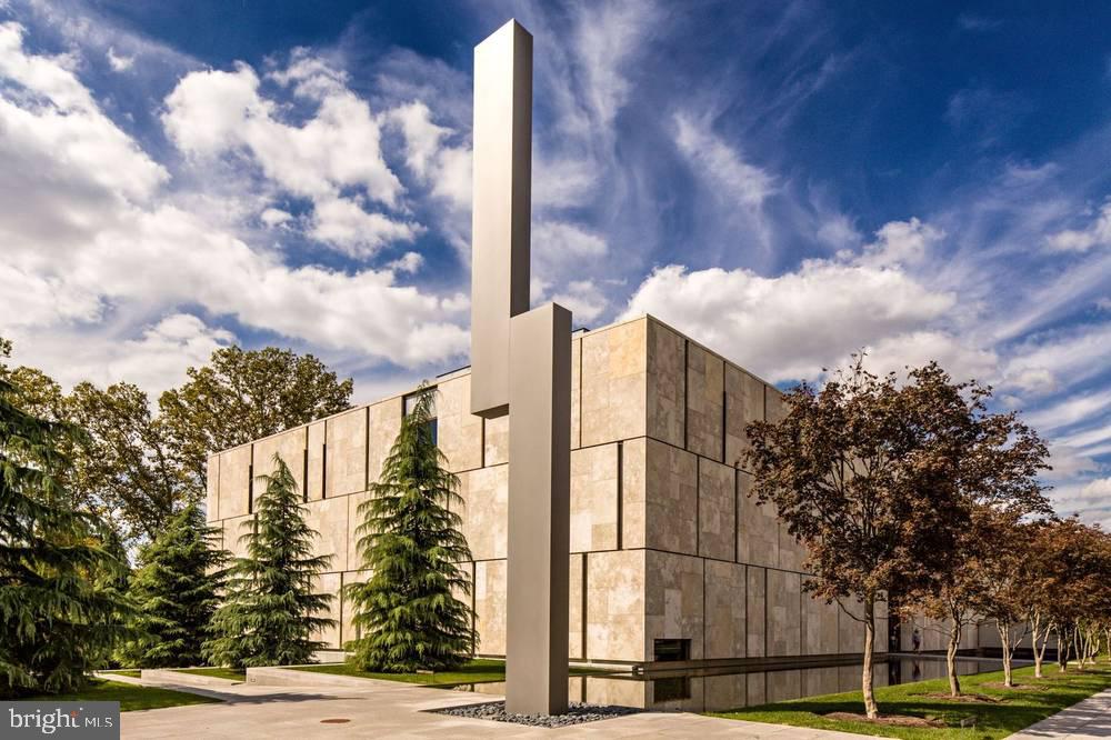 1901-39 Callowhill Street, Unit 430 Philadelphia, PA 19130 - Photo 12 of 17 a view of a multi story residential apartment building with a yard