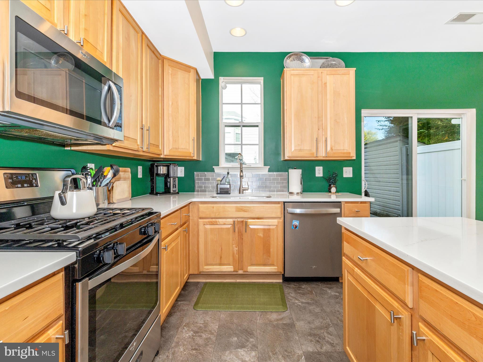 648 Tivoli Road Frederick, MD 21703 - Photo 16 of 51 a kitchen with stainless steel appliances granite countertop a stove a sink and a microwave