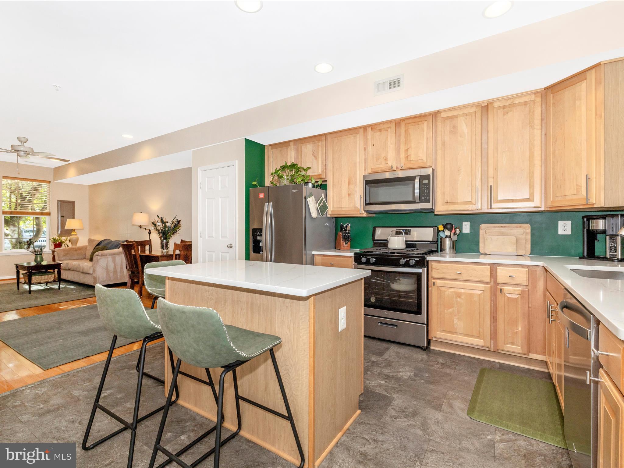 648 Tivoli Road Frederick, MD 21703 - Photo 19 of 51 a kitchen with a stove a sink and a refrigerator