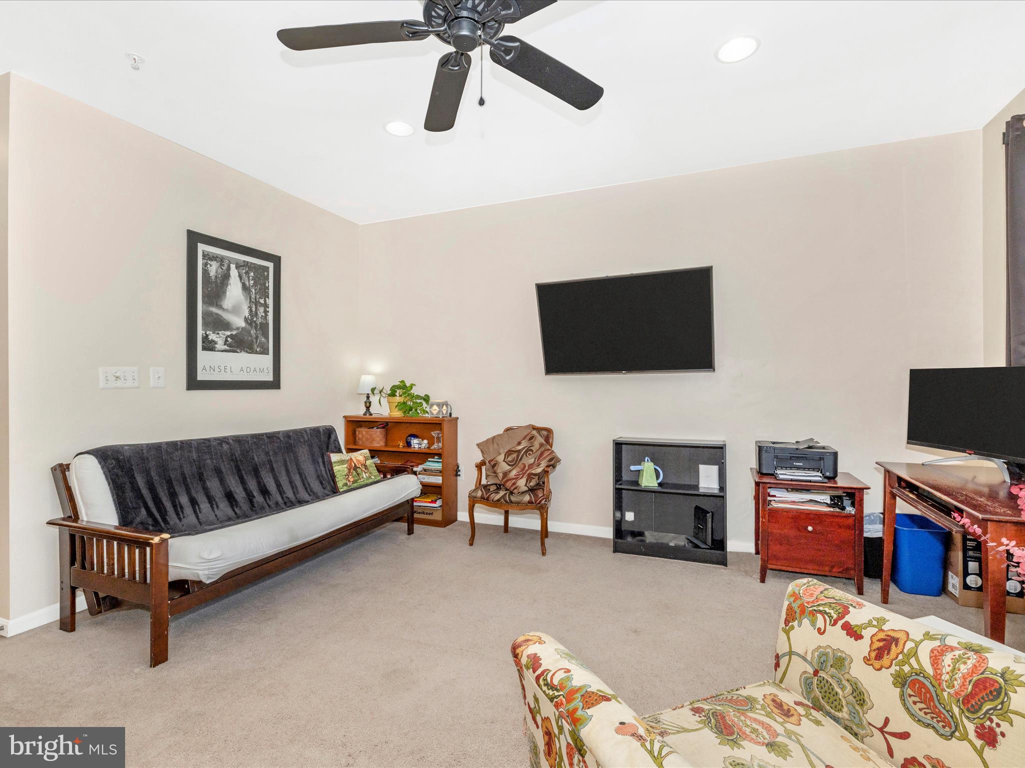 648 Tivoli Road Frederick, MD 21703 - Photo 23 of 51 a living room with furniture and a flat screen tv