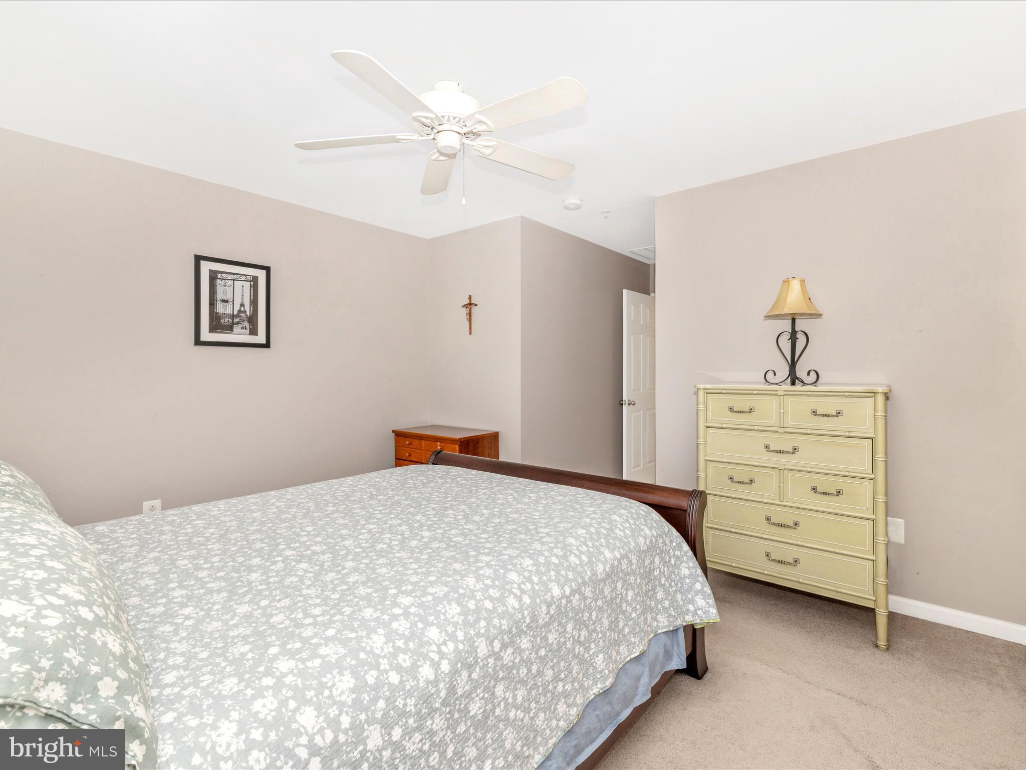 648 Tivoli Road Frederick, MD 21703 - Photo 27 of 51 a bedroom with a bed and a chandelier