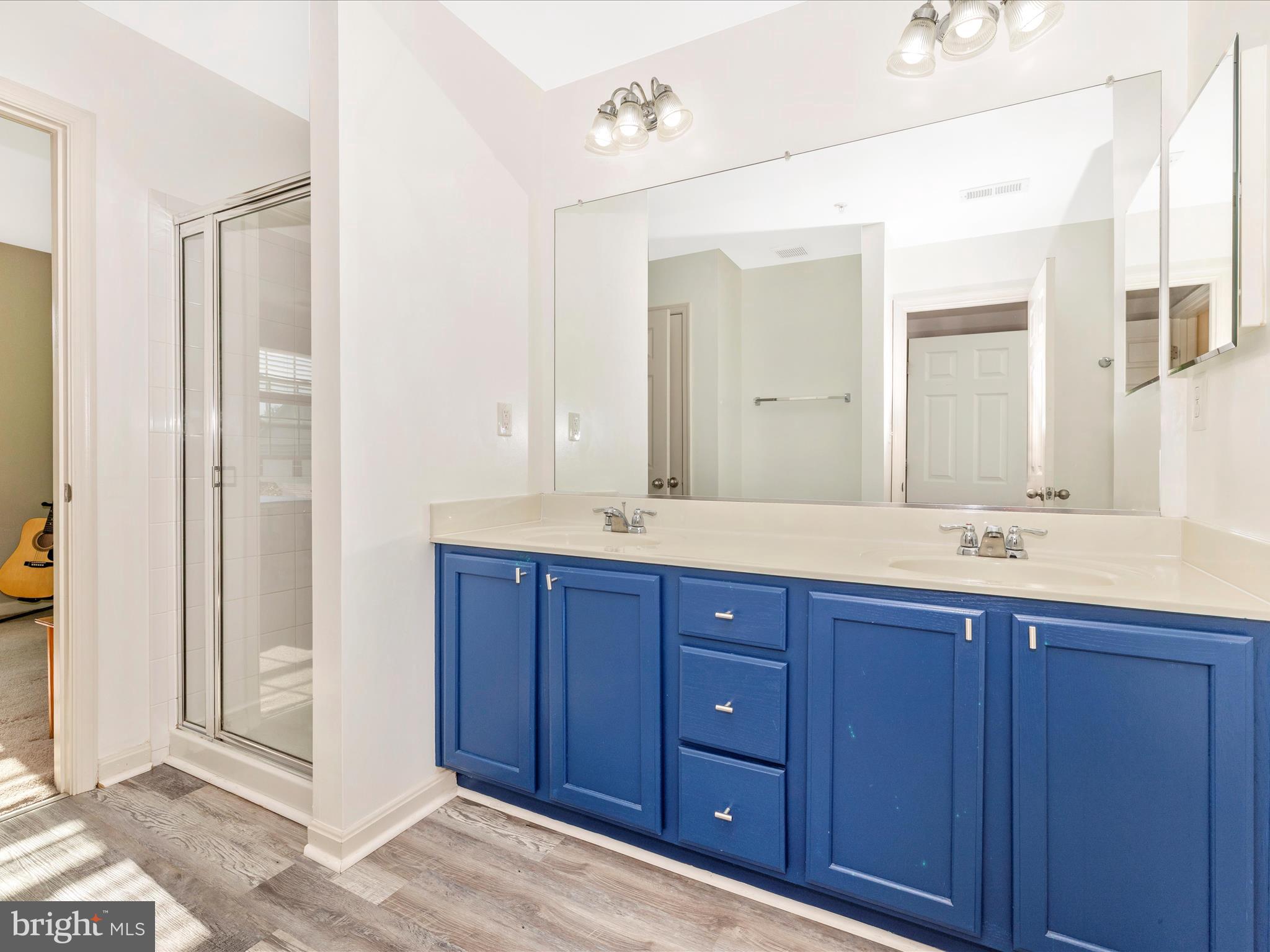 648 Tivoli Road Frederick, MD 21703 - Photo 30 of 51 a bathroom with a granite countertop double vanity sink mirror and