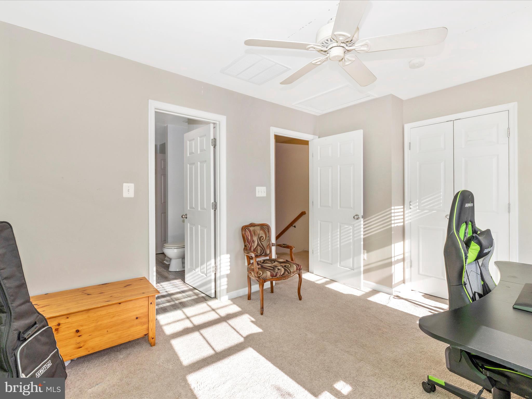 648 Tivoli Road Frederick, MD 21703 - Photo 33 of 51 a living room with furniture and a chandelier