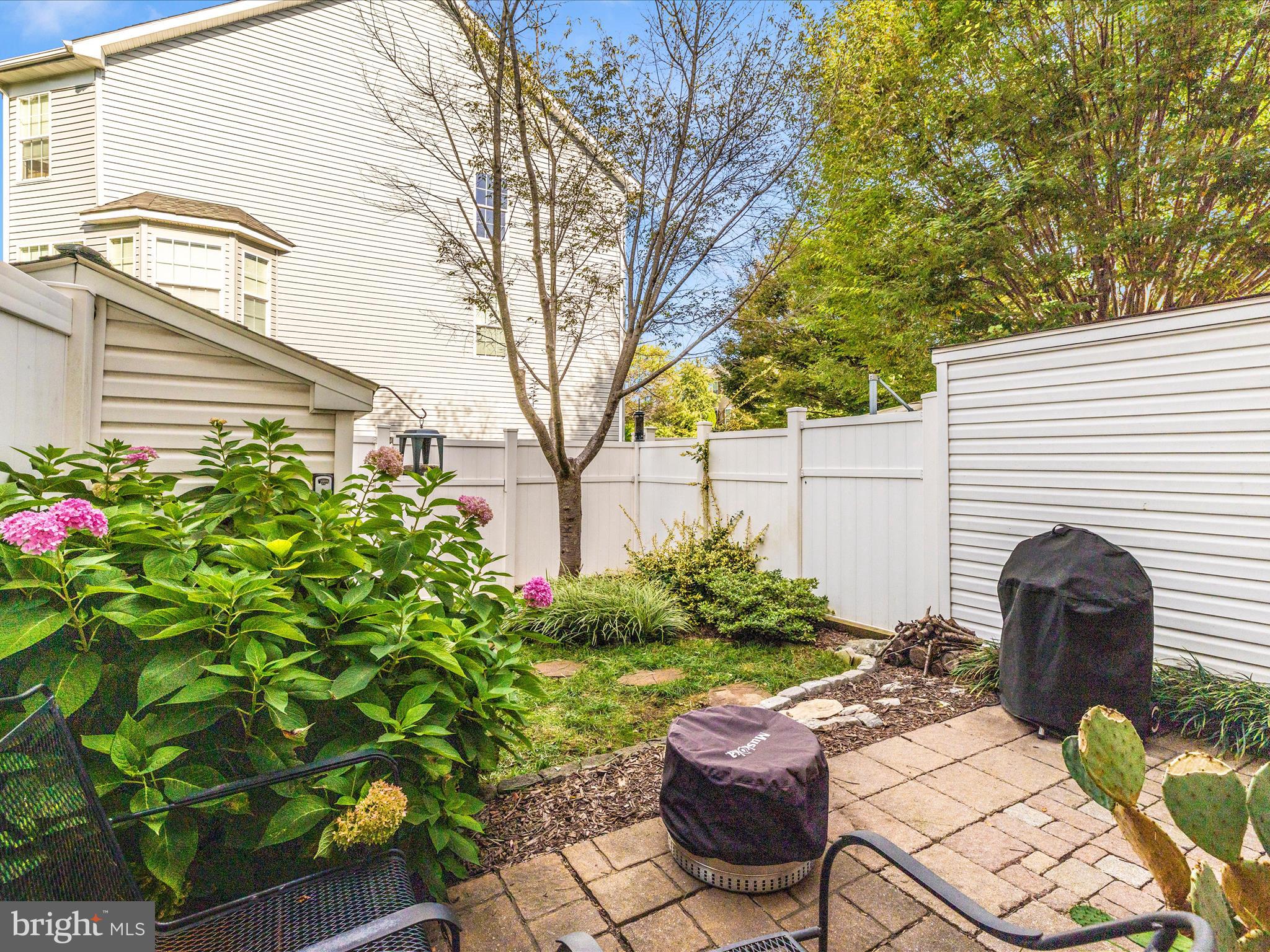 648 Tivoli Road Frederick, MD 21703 - Photo 43 of 51 a view of a backyard with chair and potted plants