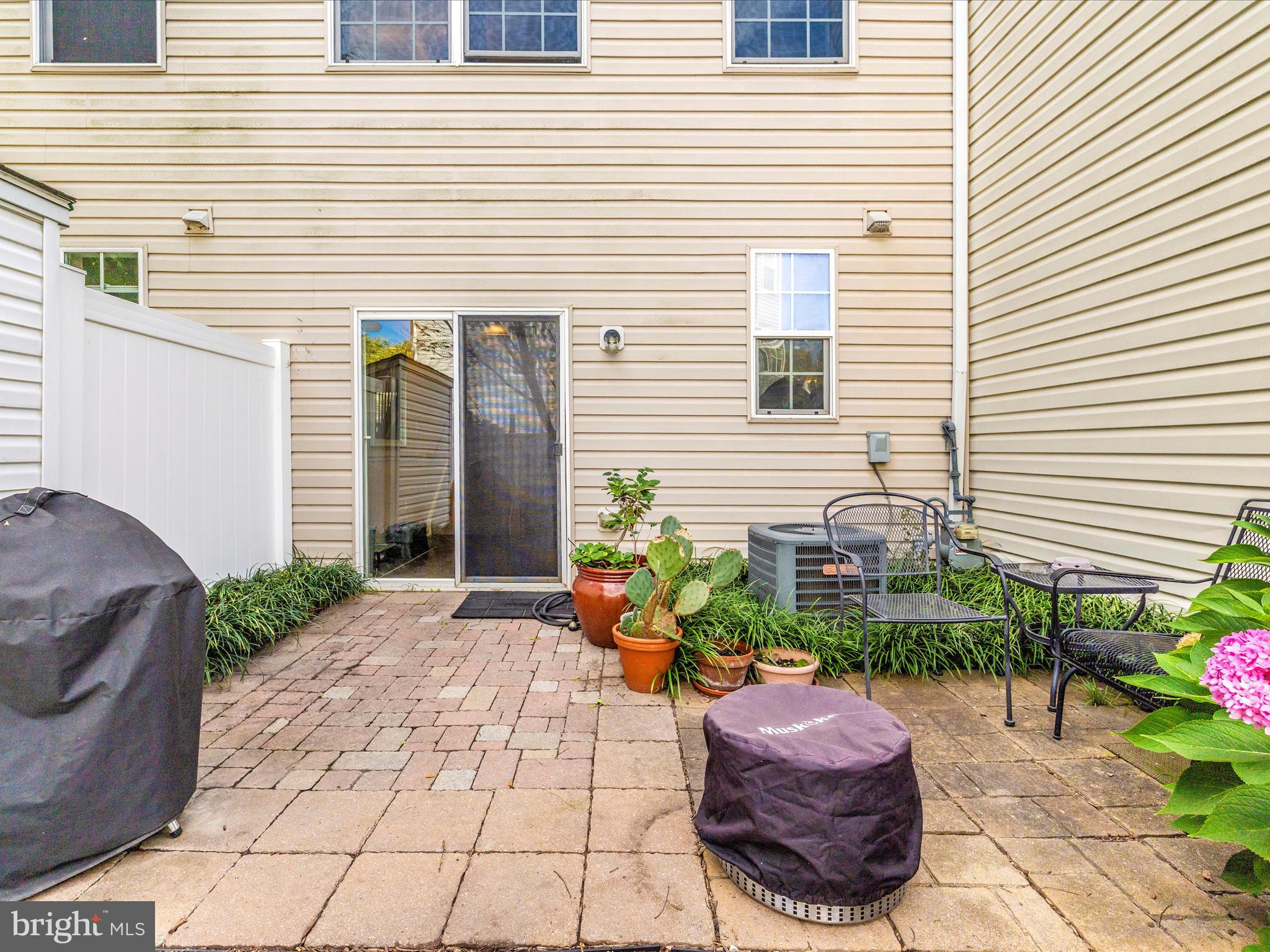 648 Tivoli Road Frederick, MD 21703 - Photo 45 of 51 a view of a backyard with chairs and potted plants