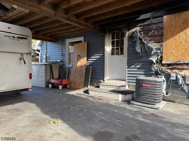 a view of a garage with parked cars