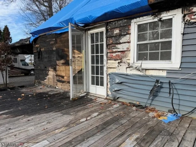 a view of front door of house and deck