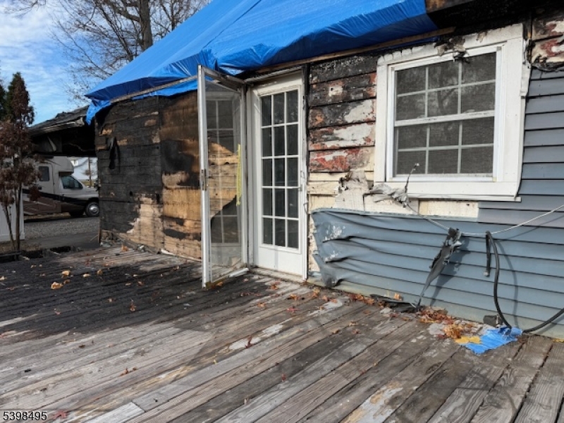 43 Madison Street Pequannock, NJ 07440 - Photo 5 of 16 a view of front door of house and deck