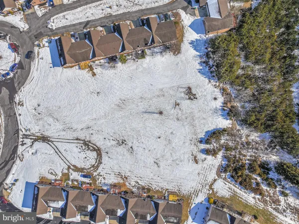 an aerial view of a house with outdoor space