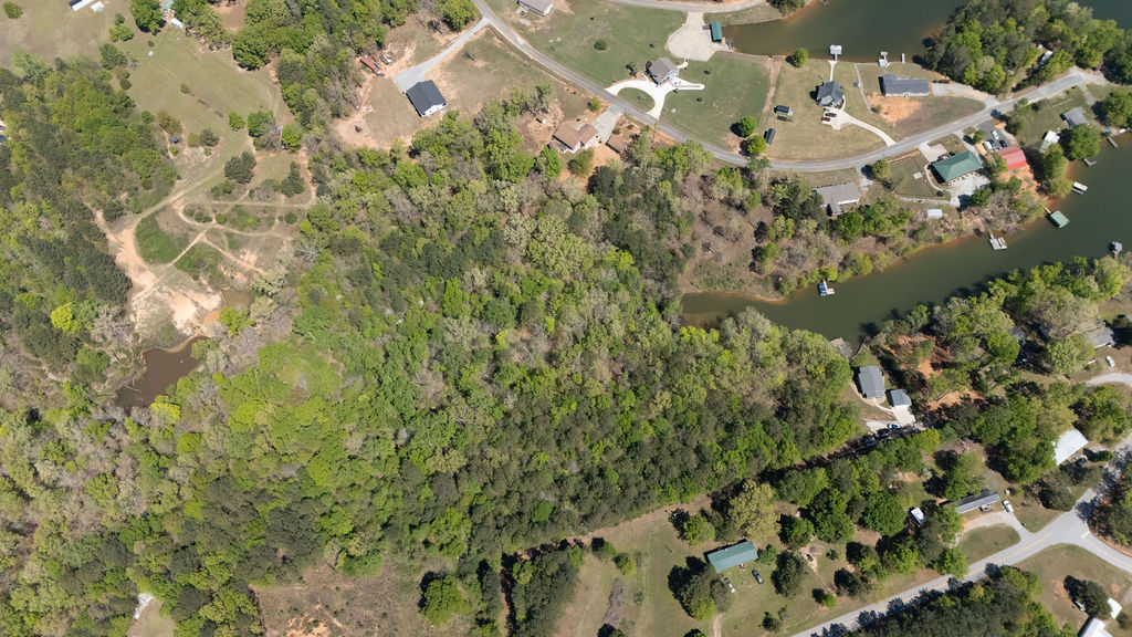 0 Bulldog Road Iva, SC 29655 - Photo 16 of 20 Mature woodlands slope gently toward the water in a quiet lakefront neighborhood.