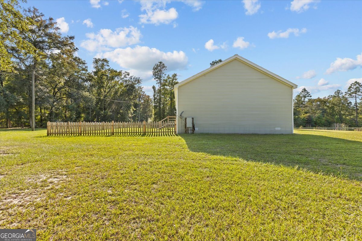 2273 Ga Highway 110 Folkston, GA 31537 - Photo 12 of 42 a view of a swimming pool with an outdoor space and seating area