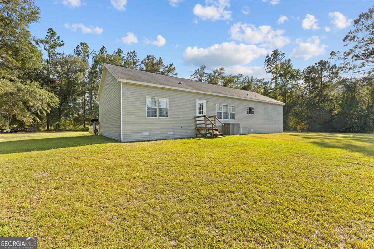 2273 Ga Highway 110 Folkston, GA 31537 - Photo 13 of 42 a house view with swimming pool in front of it