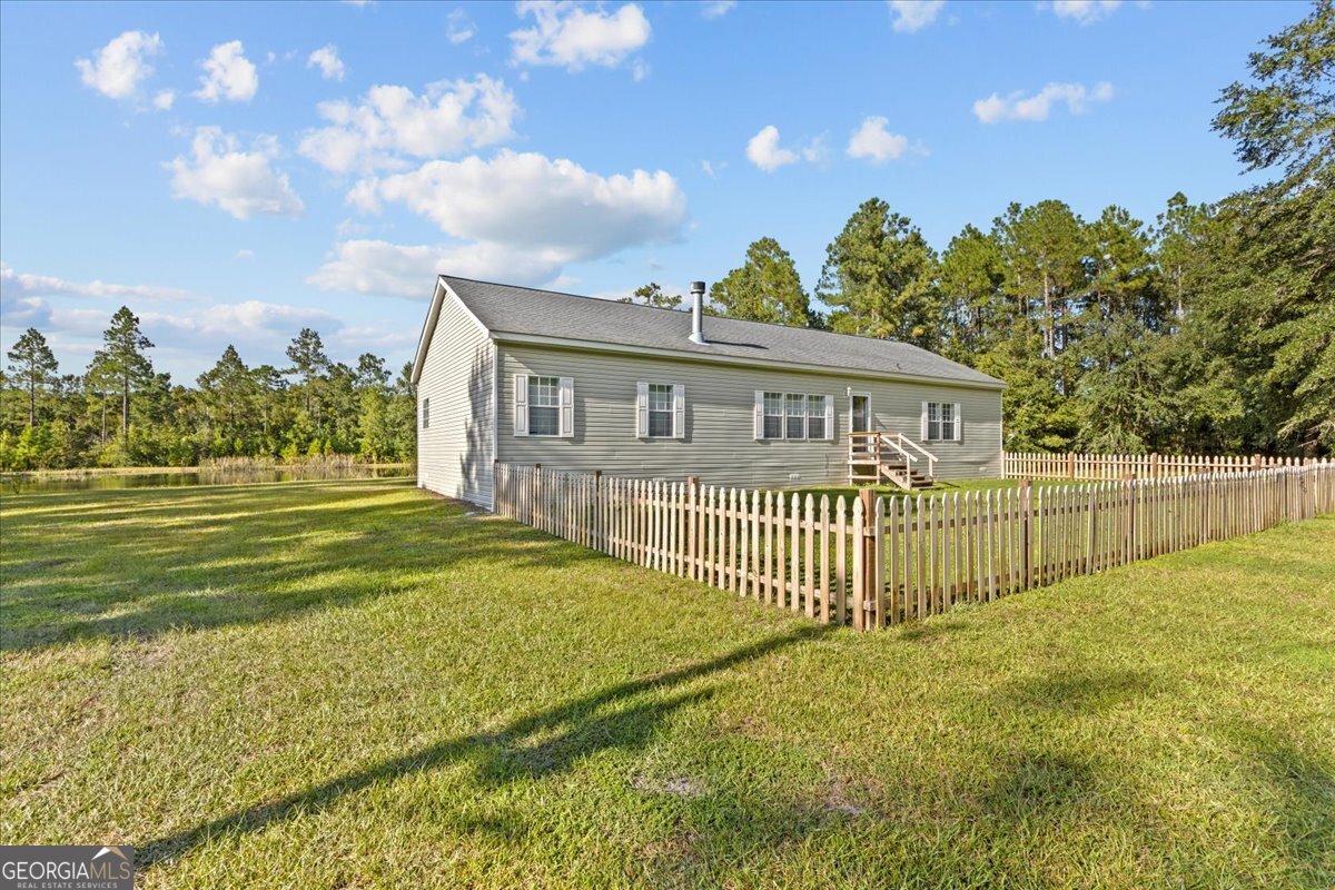 2273 Ga Highway 110 Folkston, GA 31537 - Photo 18 of 42 a view of a house with a yard