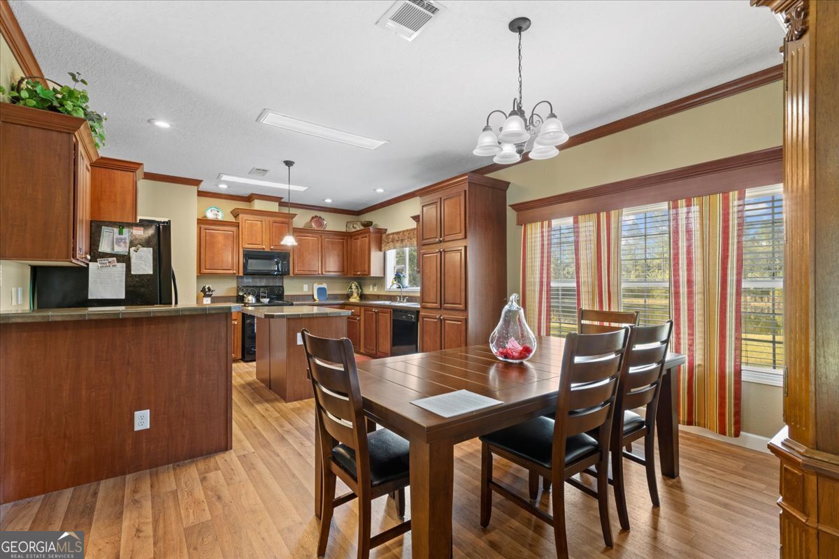 2273 Ga Highway 110 Folkston, GA 31537 - Photo 25 of 42 a view of a dining room with furniture window and outside view