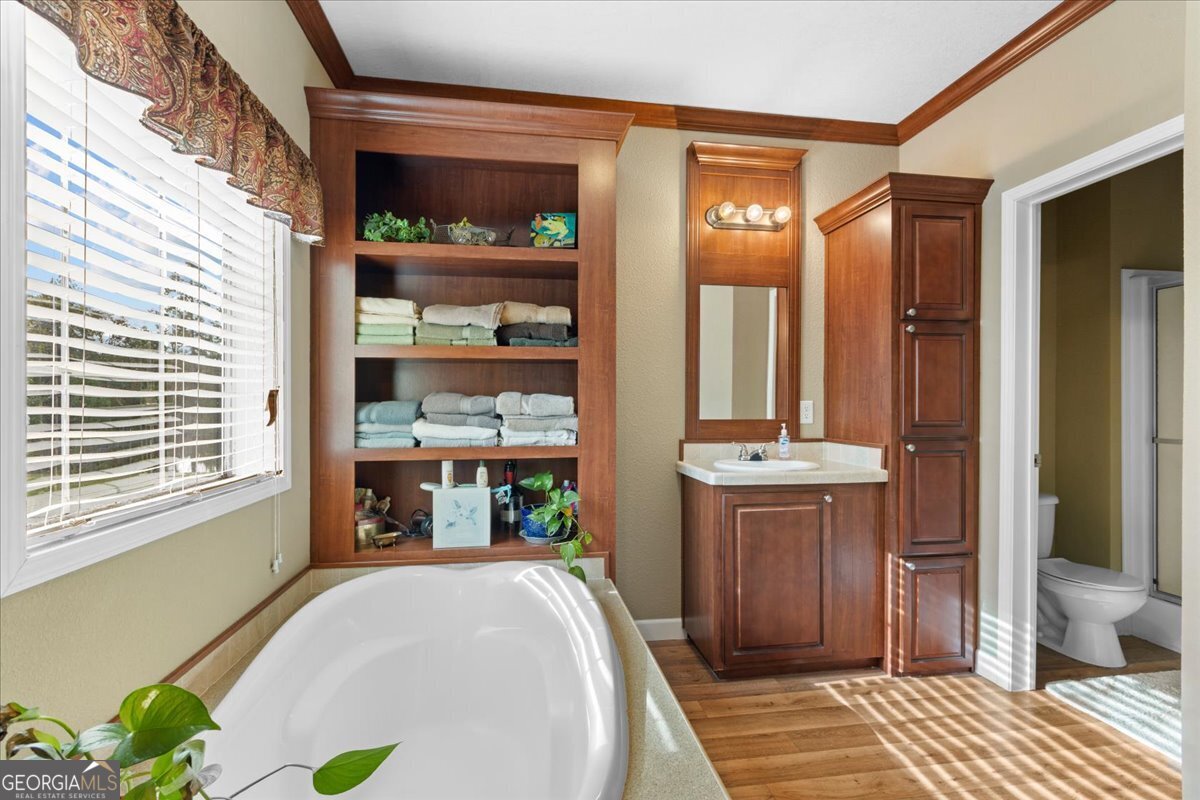 2273 Ga Highway 110 Folkston, GA 31537 - Photo 32 of 42 a view of a bathroom with a tub and shower