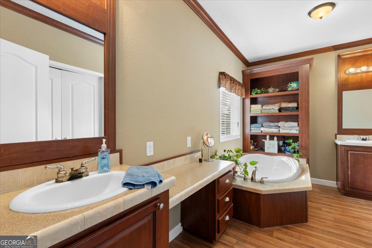2273 Ga Highway 110 Folkston, GA 31537 - Photo 33 of 42 a bathroom with a tub sink and mirror