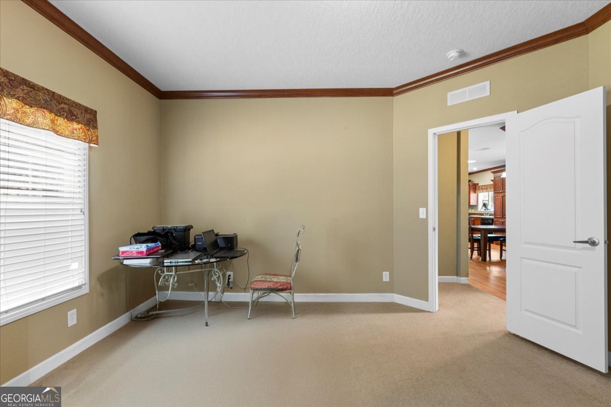 2273 Ga Highway 110 Folkston, GA 31537 - Photo 38 of 42 a room that has a bed and a chair in it