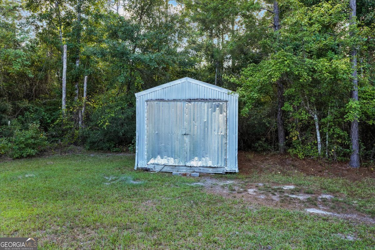 2273 Ga Highway 110 Folkston, GA 31537 - Photo 8 of 42 a small garden covered with tall trees