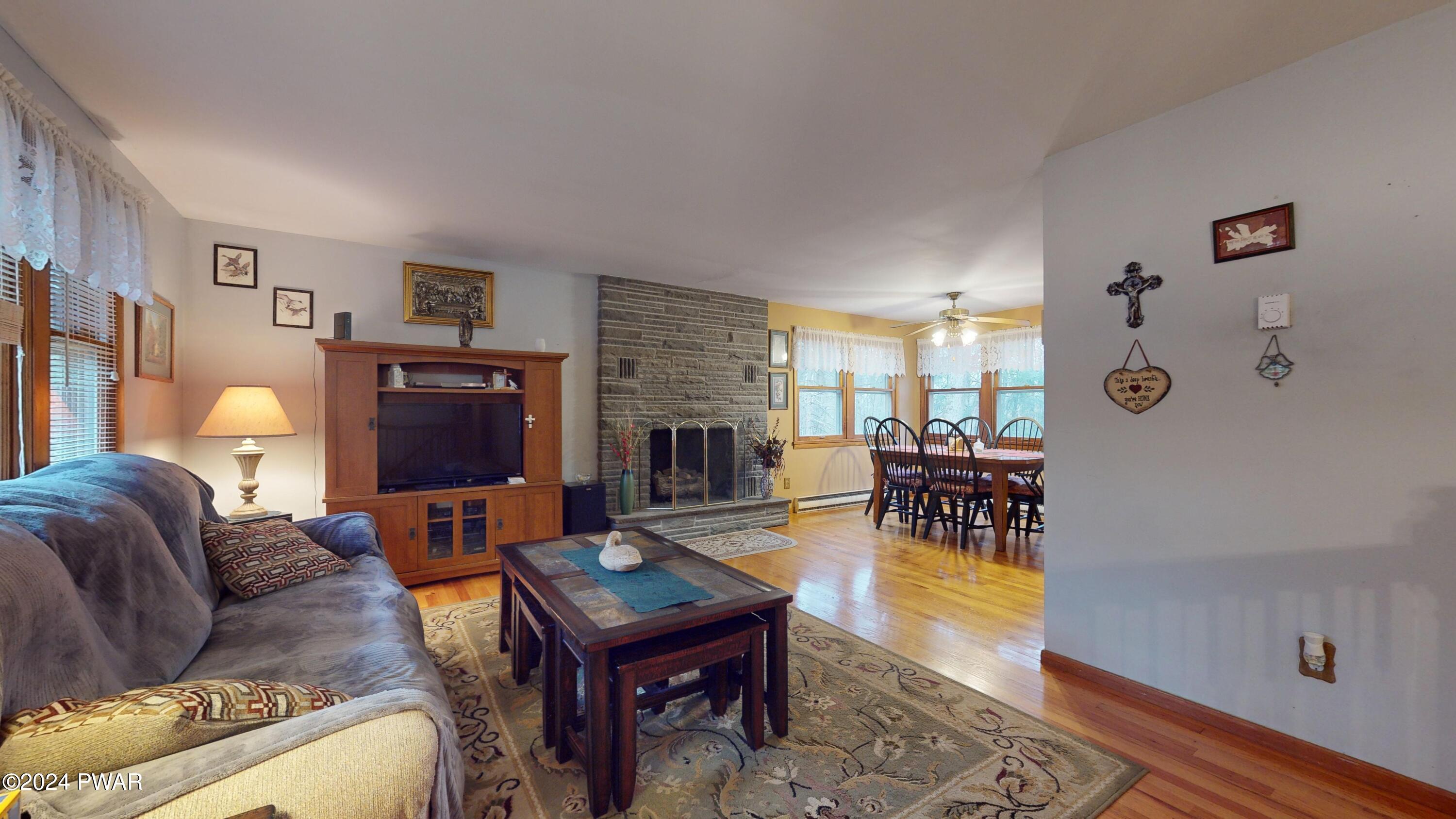 134 Sunnylands Road Milford, PA 18337 - Photo 41 of 59 a living room with furniture and a flat screen tv