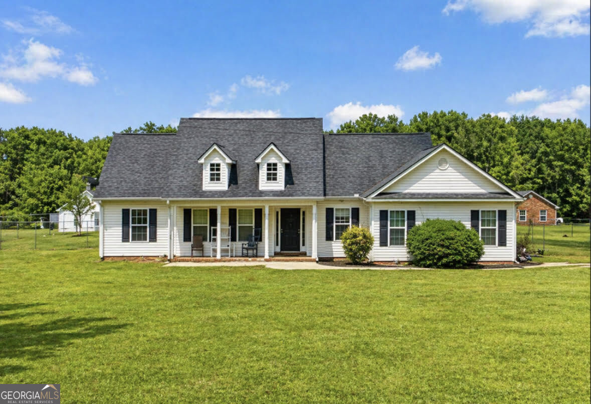 289 High Falls Road Jackson, GA 30233 - Photo 1 of 1 a front view of a house with a yard