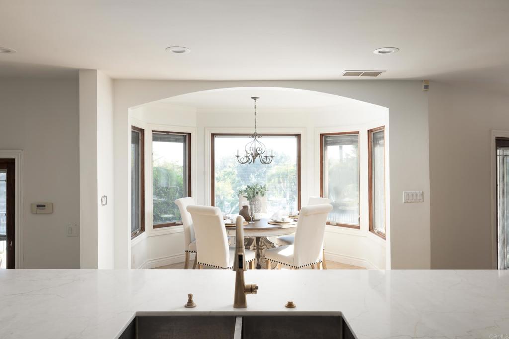 15017 Skyridge Road Poway, CA 92064 - Photo 11 of 54 a view of a dining room with furniture window and outside view