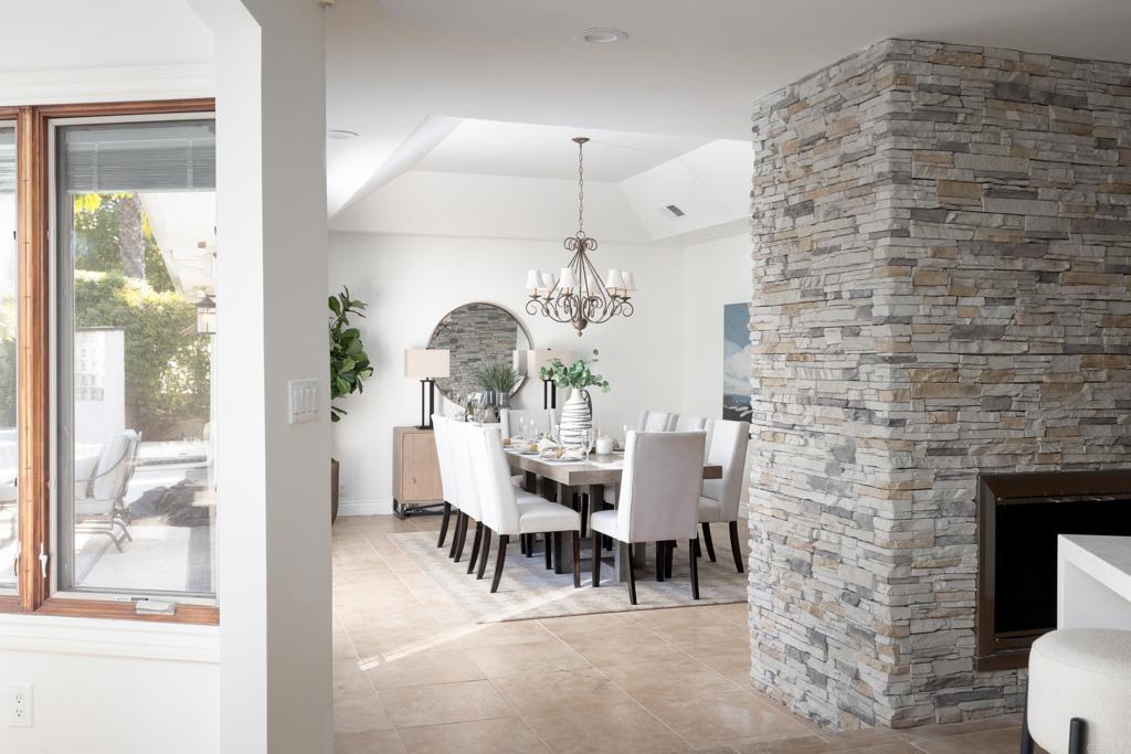 15017 Skyridge Road Poway, CA 92064 - Photo 15 of 54 a view of a dining room with furniture and wooden floor