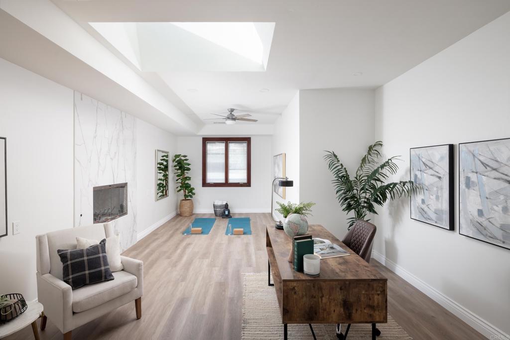 15017 Skyridge Road Poway, CA 92064 - Photo 17 of 54 a living room with furniture and a potted plant