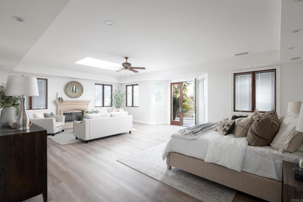 15017 Skyridge Road Poway, CA 92064 - Photo 18 of 54 a bedroom with a large bed and a large window