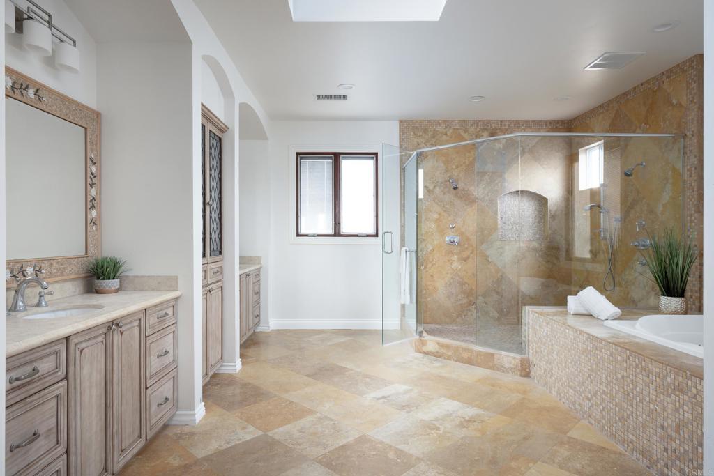 15017 Skyridge Road Poway, CA 92064 - Photo 20 of 54 a bathroom with a sink a toilet and shower