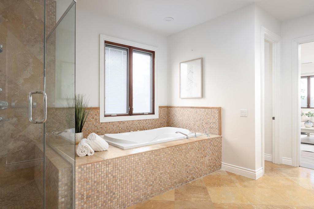 15017 Skyridge Road Poway, CA 92064 - Photo 21 of 54 a bathroom with a bathtub sink and mirror