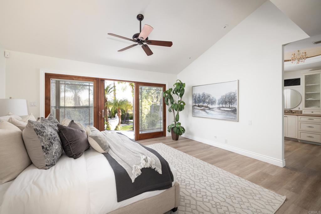 15017 Skyridge Road Poway, CA 92064 - Photo 24 of 54 a bedroom with a large bed and a window