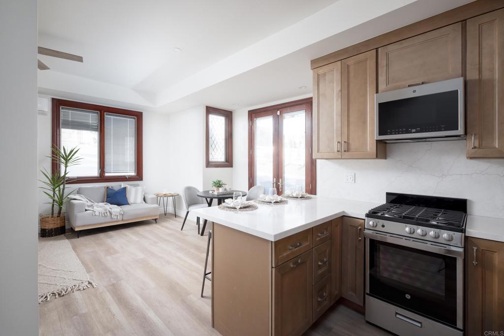 15017 Skyridge Road Poway, CA 92064 - Photo 30 of 54 a kitchen with a stove and a microwave