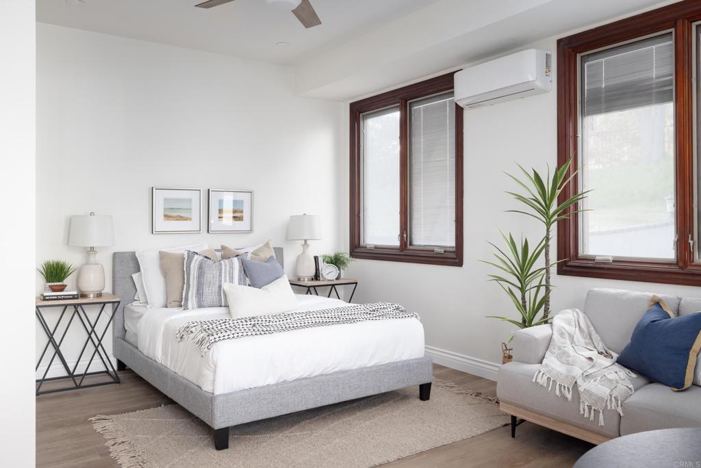 15017 Skyridge Road Poway, CA 92064 - Photo 32 of 54 a bedroom with a bed and a couch