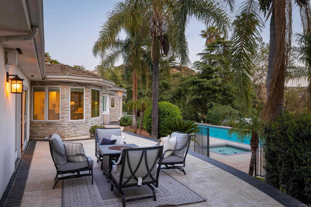 15017 Skyridge Road Poway, CA 92064 - Photo 36 of 54 a view of a patio with a table and chairs