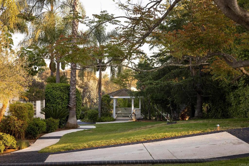 15017 Skyridge Road Poway, CA 92064 - Photo 39 of 54 a front view of a house with a yard