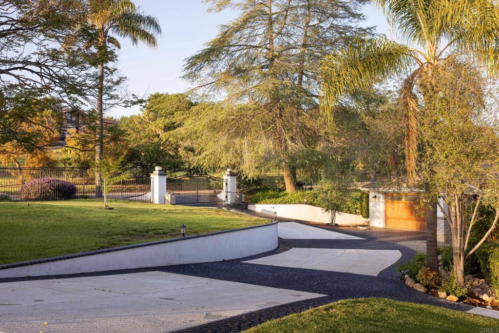 15017 Skyridge Road Poway, CA 92064 - Photo 40 of 54 a view of a yard with palm trees