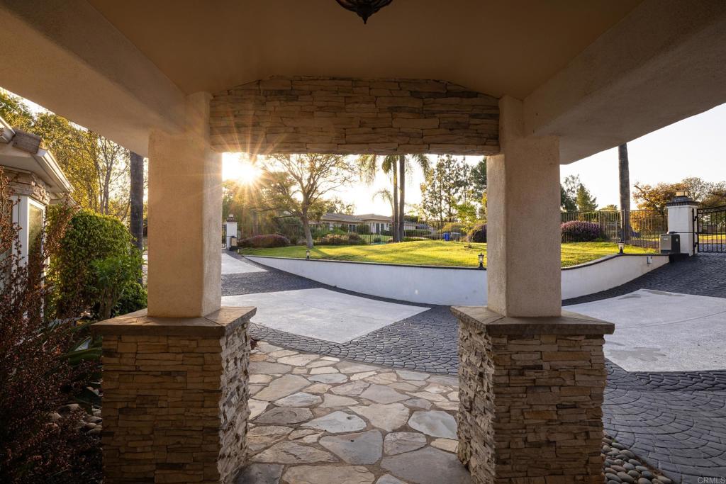 15017 Skyridge Road Poway, CA 92064 - Photo 4 of 54 a view of a porch with furniture and a yard