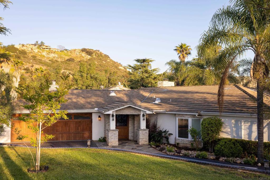 15017 Skyridge Road Poway, CA 92064 - Photo 5 of 54 a front view of house with yard and green space