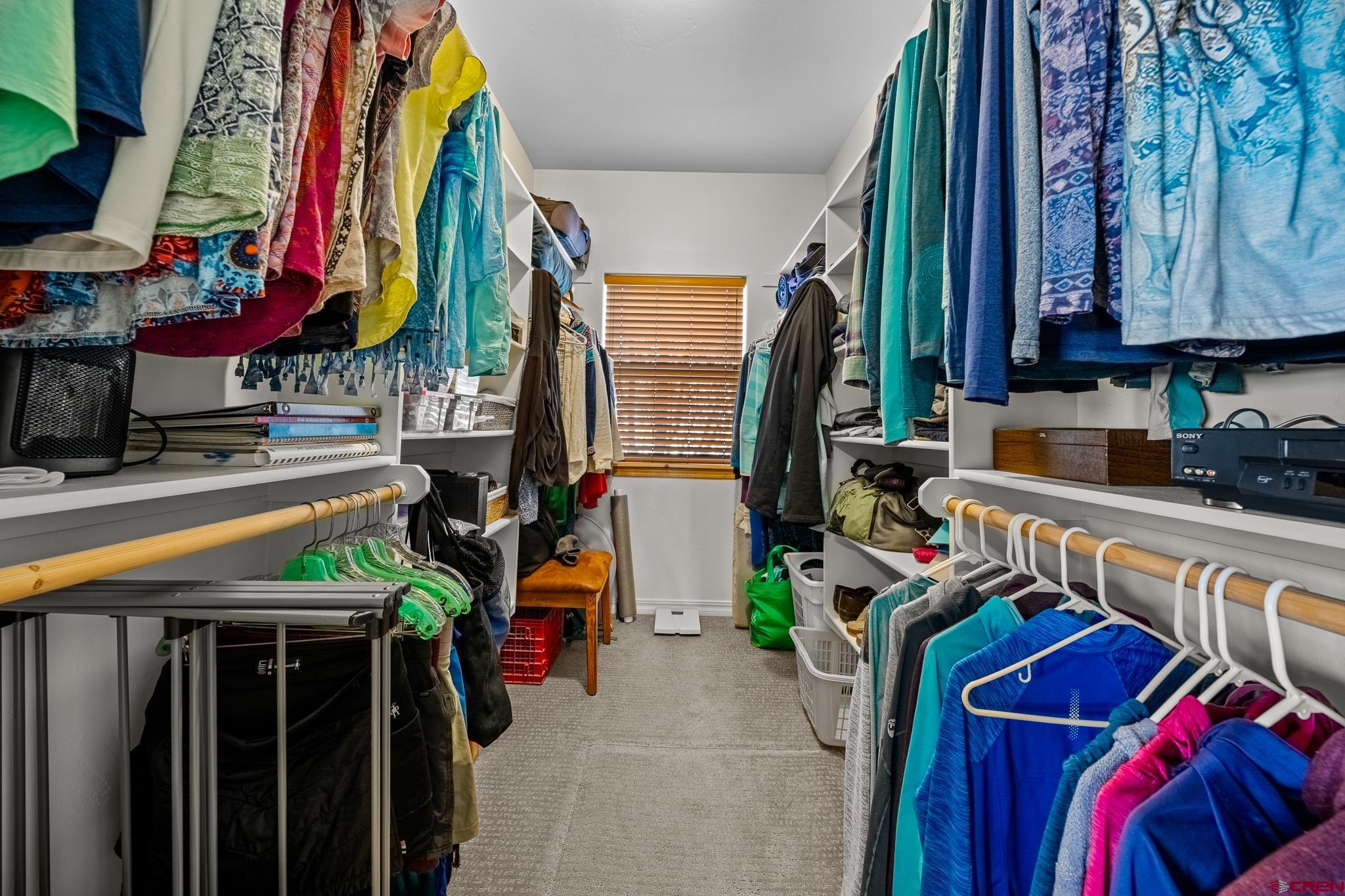 72 Cedar Ridge Way Durango, CO 81301 - Photo 16 of 33 a view of walk in closet with clothes