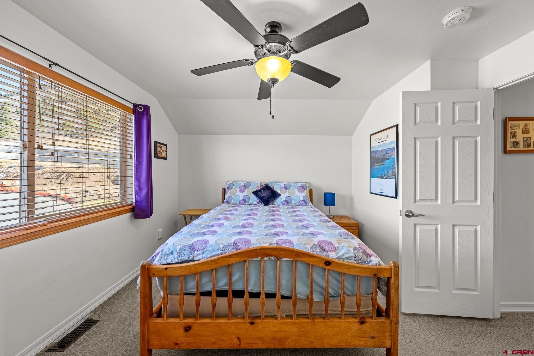 72 Cedar Ridge Way Durango, CO 81301 - Photo 17 of 33 a bedroom with a bed and window