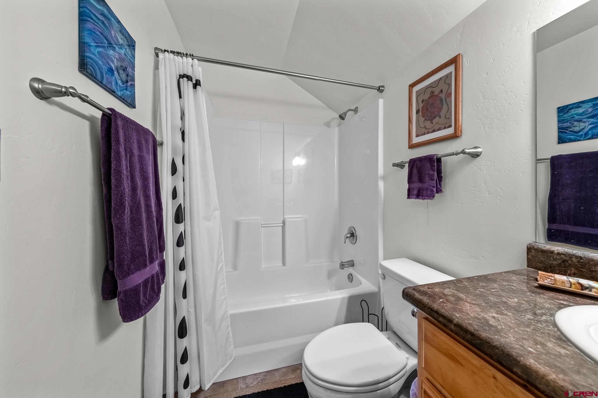 72 Cedar Ridge Way Durango, CO 81301 - Photo 22 of 33 a bathroom with a granite countertop toilet sink and bathtub